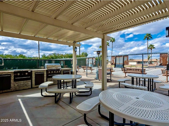 425 S Parkcrest Unit 323, Mesa, AZ 85206 - view of patio / terrace featuring exterior kitchen and a pergola