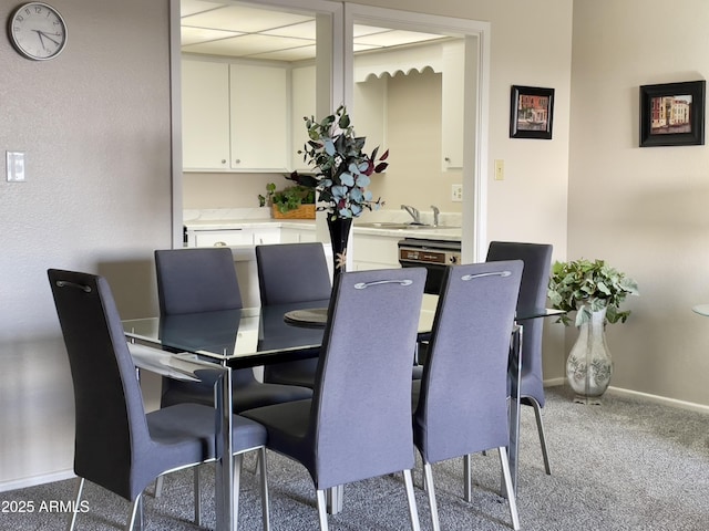 425 S Parkcrest Unit 323, Mesa, AZ 85206 - carpeted dining room featuring baseboards and a sink