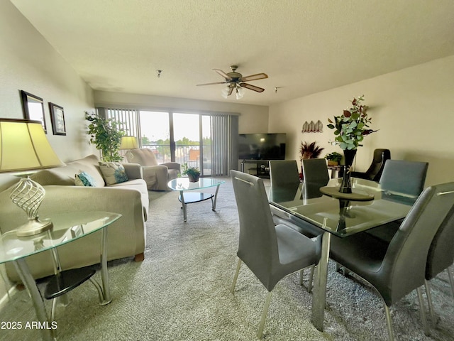 425 S Parkcrest Unit 323, Mesa, AZ 85206 - dining area with ceiling fan, carpet, and a textured ceiling