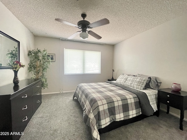 425 S Parkcrest Unit 323, Mesa, AZ 85206 - carpeted bedroom with a textured ceiling and a ceiling fan