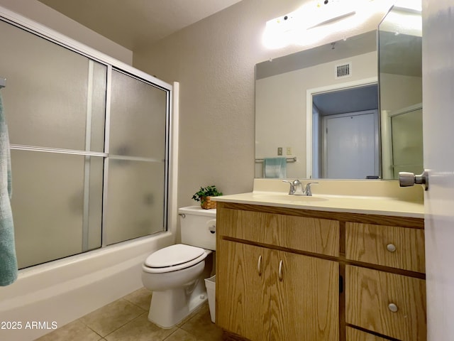 425 S Parkcrest Unit 323, Mesa, AZ 85206 - bathroom featuring tile patterned flooring, vanity, and bath / shower combo with glass door