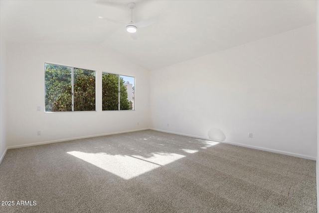 unfurnished room with carpet floors, vaulted ceiling, and ceiling fan