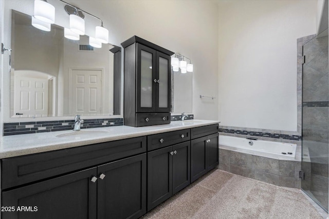 bathroom featuring separate shower and tub and vanity