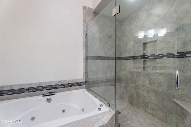 bathroom featuring shower with separate bathtub