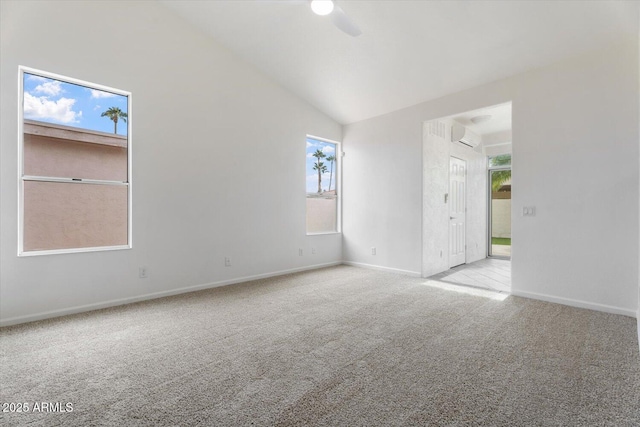 carpeted spare room with a wall unit AC, ceiling fan, plenty of natural light, and high vaulted ceiling