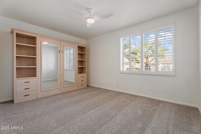 unfurnished bedroom featuring ceiling fan and light colored carpet