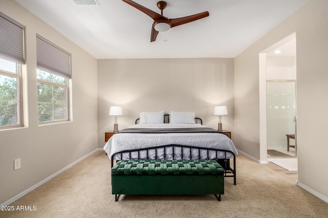 1825 E Hampton Ln Unit 108, Gilbert, AZ 85295 - carpeted bedroom featuring baseboards, ensuite bath, and ceiling fan