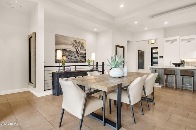 dining room with recessed lighting, light tile patterned flooring, and baseboards