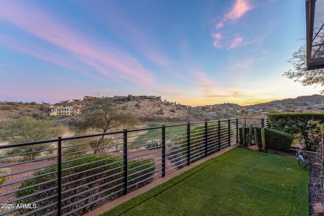 view of yard featuring a mountain view and a balcony