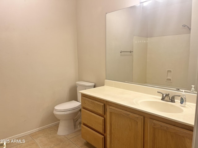 bathroom with tile patterned floors, vanity, and toilet