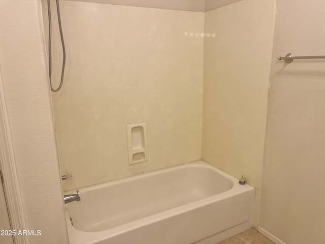 bathroom with tile patterned flooring and shower / washtub combination