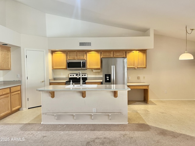 kitchen featuring sink, hanging light fixtures, light carpet, a center island with sink, and appliances with stainless steel finishes