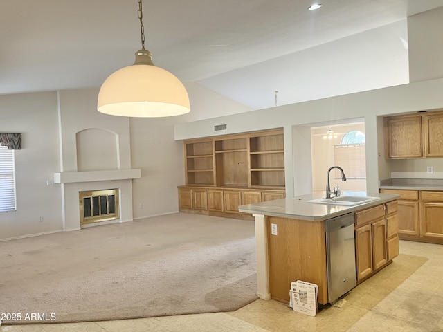 kitchen with dishwasher, sink, pendant lighting, light carpet, and a center island with sink