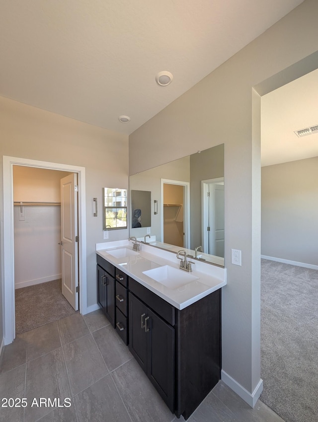 9412 E Sequence Ave, Mesa, AZ 85212 - full bathroom with a spacious closet and double vanity