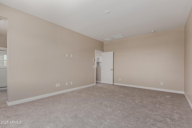 9412 E Sequence Ave, Mesa, AZ 85212 - spare room featuring light carpet and baseboards
