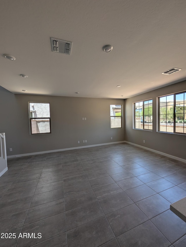 9412 E Sequence Ave, Mesa, AZ 85212 - spare room with dark tile patterned floors and recessed lighting