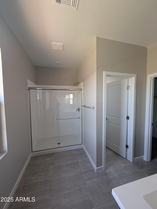 9412 E Sequence Ave, Mesa, AZ 85212 - bathroom featuring a stall shower, tile patterned floors, and vanity
