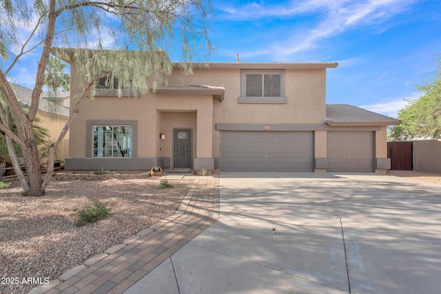 308 E Sheffield Ct, Gilbert, AZ 85296 - view of front of property featuring stucco siding, driveway, a tiled roof, an attached garage, and a garage