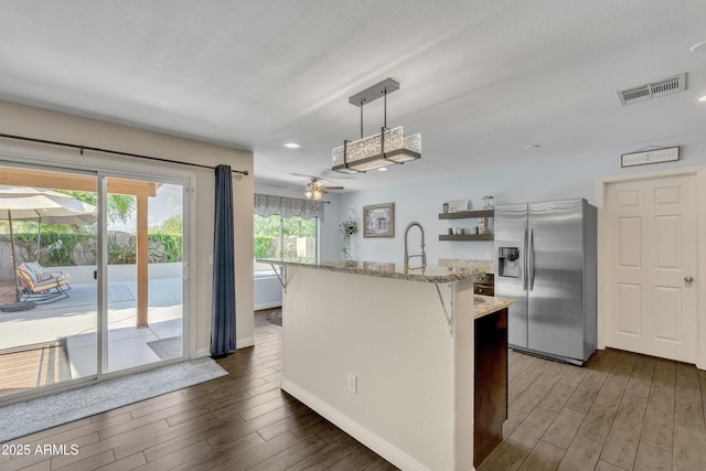 308 E Sheffield Ct, Gilbert, AZ 85296 - kitchen with stainless steel refrigerator with ice dispenser, wood finished floors, ceiling fan, light stone counters, and recessed lighting