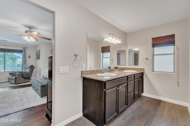 308 E Sheffield Ct, Gilbert, AZ 85296 - ensuite bathroom featuring double vanity, wood finished floors, and ceiling fan