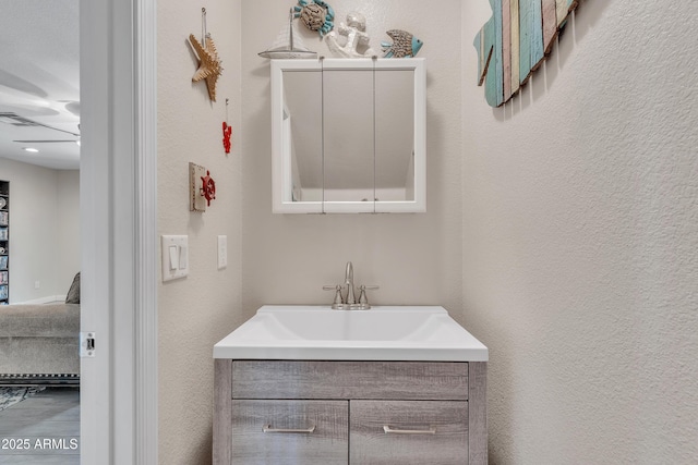 308 E Sheffield Ct, Gilbert, AZ 85296 - bathroom featuring connected bathroom, vanity, and a textured wall