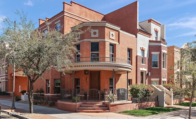 view of front of property featuring brick siding