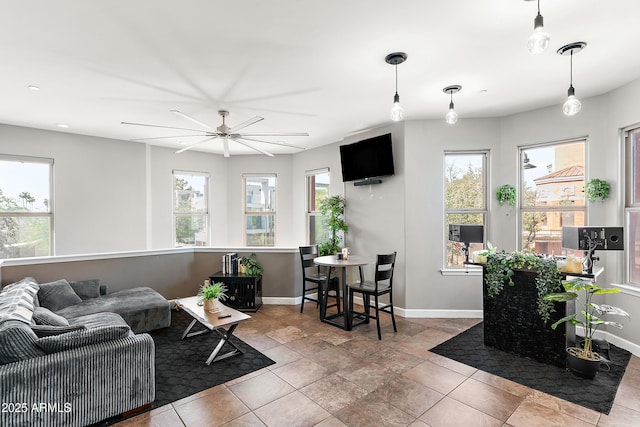 living room with a healthy amount of sunlight and baseboards