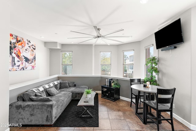 living area featuring baseboards