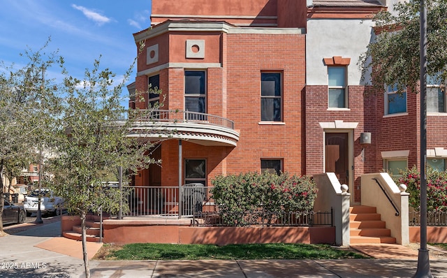 view of front of property featuring brick siding