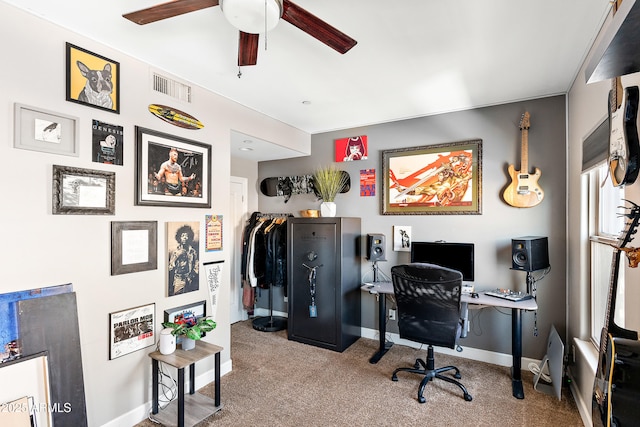 office area with visible vents, carpet floors, baseboards, and ceiling fan