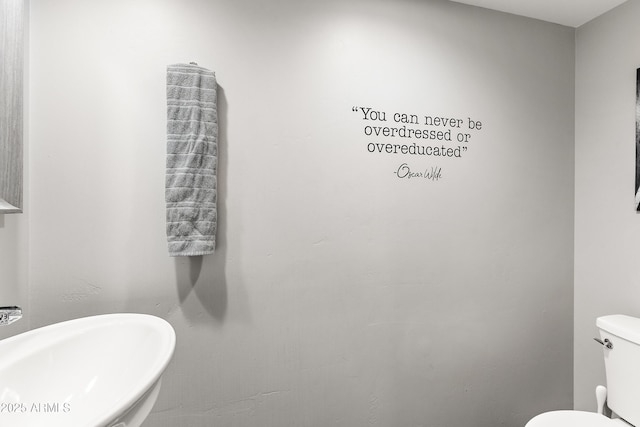 bathroom featuring a sink and toilet