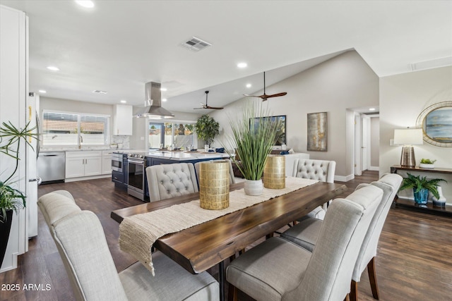 dining space with lofted ceiling, ceiling fan, and dark hardwood / wood-style floors