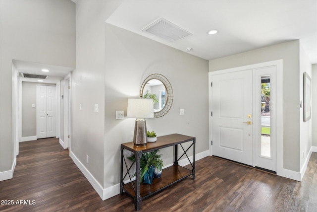 entrance foyer with dark hardwood / wood-style floors