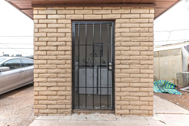 entrance to property featuring stone siding