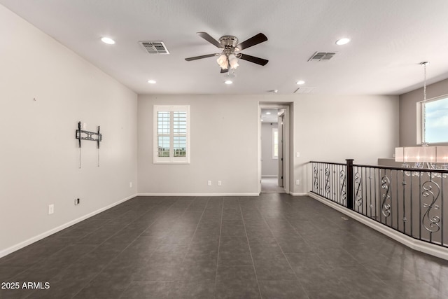 empty room featuring baseboards, a ceiling fan, recessed lighting, and visible vents