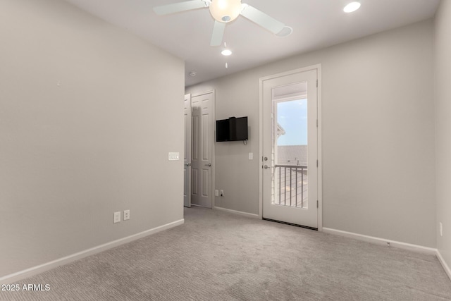 spare room with baseboards, ceiling fan, carpet, and recessed lighting