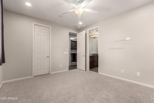 unfurnished bedroom featuring carpet flooring, recessed lighting, baseboards, and ensuite bath