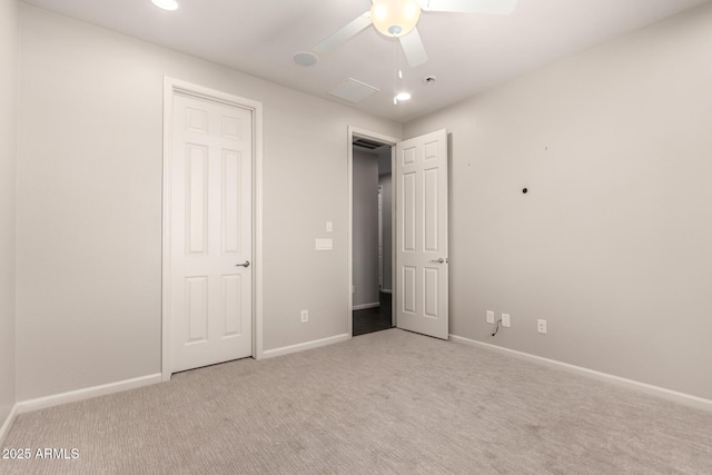 unfurnished bedroom featuring recessed lighting, baseboards, and carpet