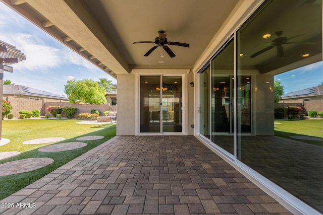 view of patio featuring a fenced backyard and a ceiling fan