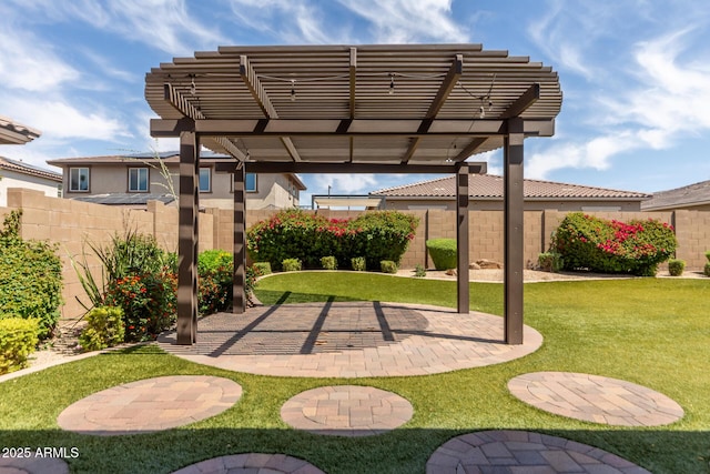 view of yard featuring a fenced backyard, a patio area, and a pergola