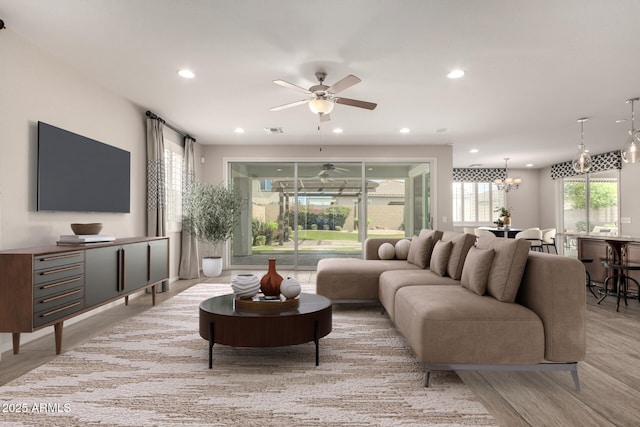 living area with visible vents, recessed lighting, and a wealth of natural light