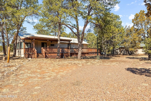 exterior space with ceiling fan