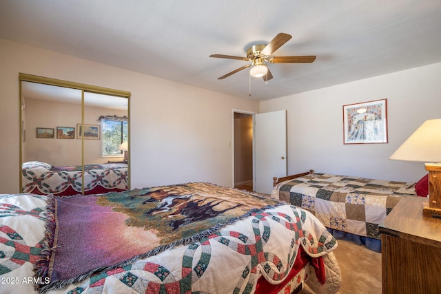 bedroom featuring carpet flooring, a ceiling fan, and a closet