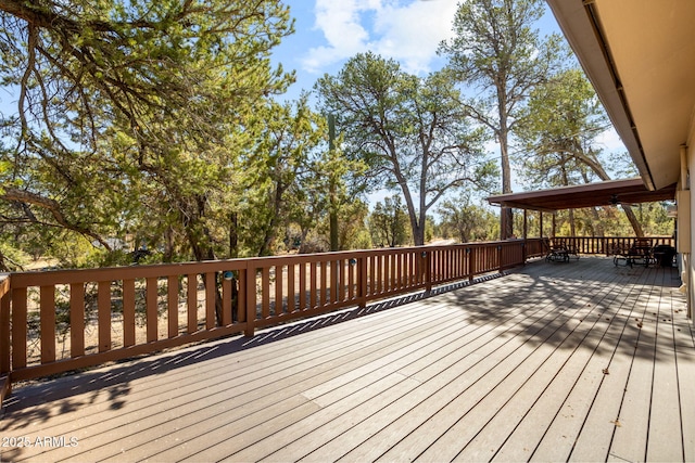 wooden deck featuring outdoor dining area