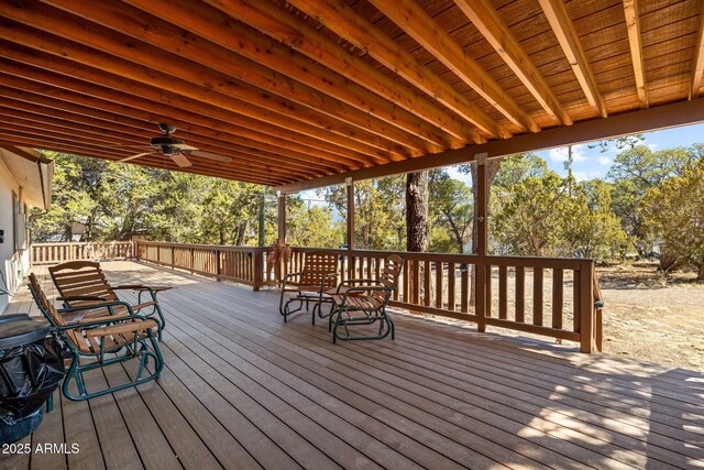 wooden deck with a ceiling fan