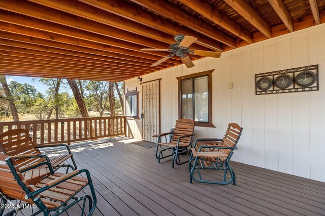 wooden terrace featuring a ceiling fan