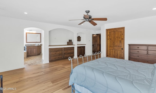 3611 E Ahwatukee Dr, Phoenix, AZ 85044 - bedroom with light wood-style floors, recessed lighting, arched walkways, ensuite bathroom, and a ceiling fan