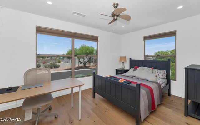 3611 E Ahwatukee Dr, Phoenix, AZ 85044 - bedroom featuring multiple windows, an office area, light wood-style flooring, and recessed lighting