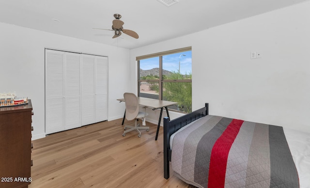 3611 E Ahwatukee Dr, Phoenix, AZ 85044 - bedroom featuring wood finished floors, ceiling fan, and a closet