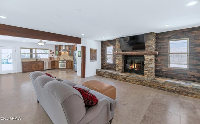 3611 E Ahwatukee Dr, Phoenix, AZ 85044 - living room with recessed lighting, a stone fireplace, and beamed ceiling